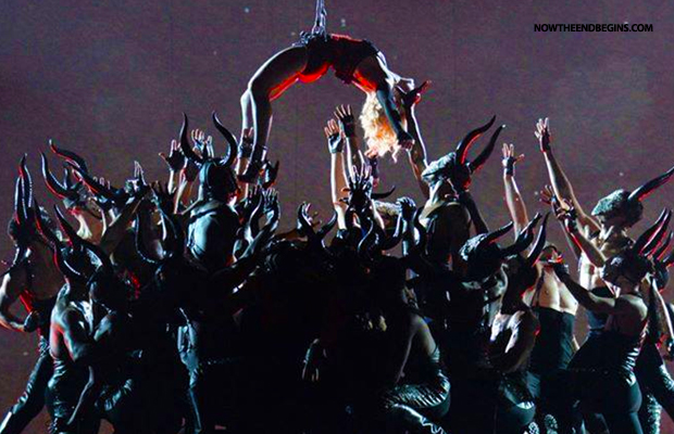 Madonna 2015 Grammys hanging over pit of demons