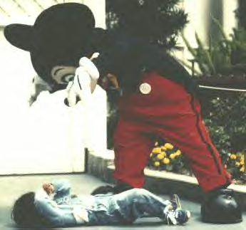 Mickey Mouse costumed character traumatizing a child